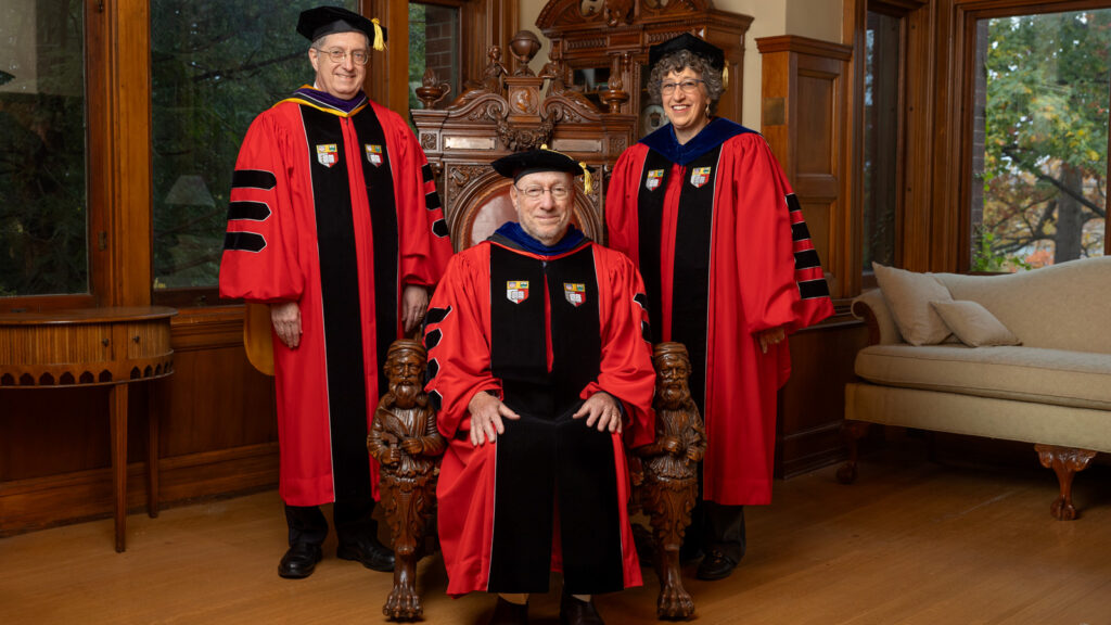 President Michael Kotlikoff, center, poses in academic regalia with two former Cornell presidents, Jeffrey Lehman ’77, left, and Martha Pollack, right, in the A.D. White House