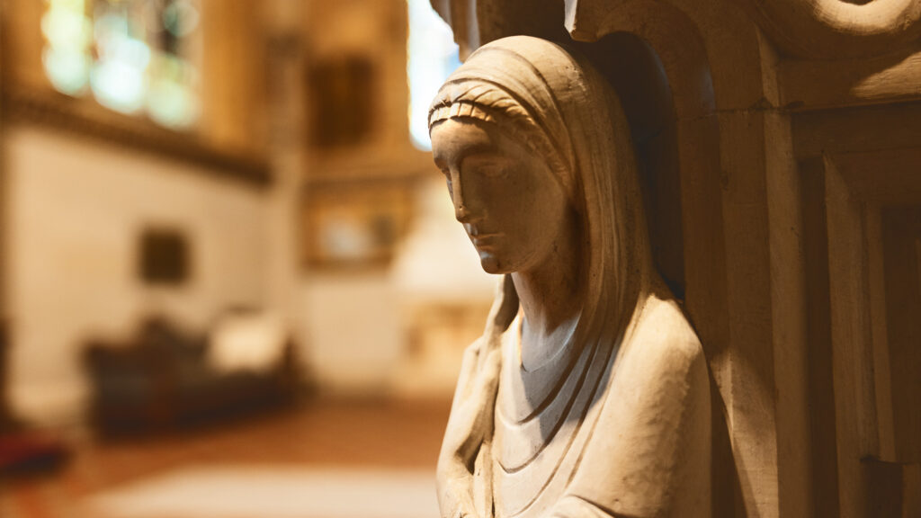 a carved figure on the sarcophagus honoring several members of Andrew D. White's family in the Sage Chapel memorial antechapel