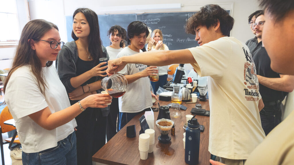Jeffrey Huang pours coffee during a meeting of the Cornell Coffee Club in Goldwin Smith Hall on Sunday, October 19, 2025. (Ryan Young / Cornell University)