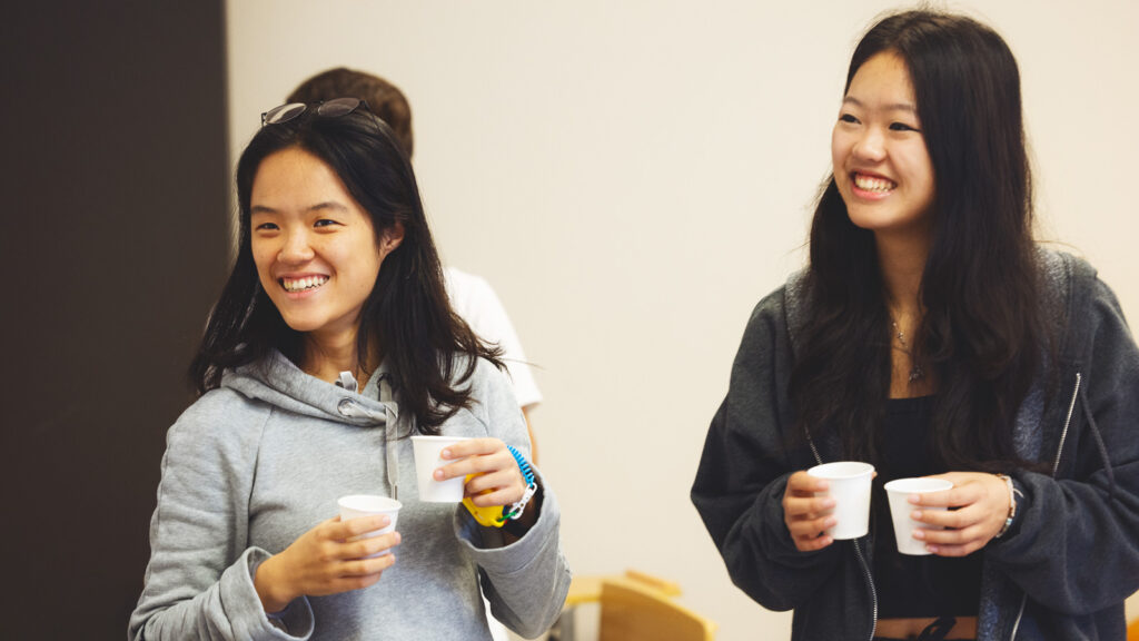 Flora Meng, left, and club Vice President Kalia Cheung, right, have a laugh of the Cornell Coffee Club meet in Goldwin Smith Hall on Sunday, October 19, 2025. (Ryan Young / Cornell University)