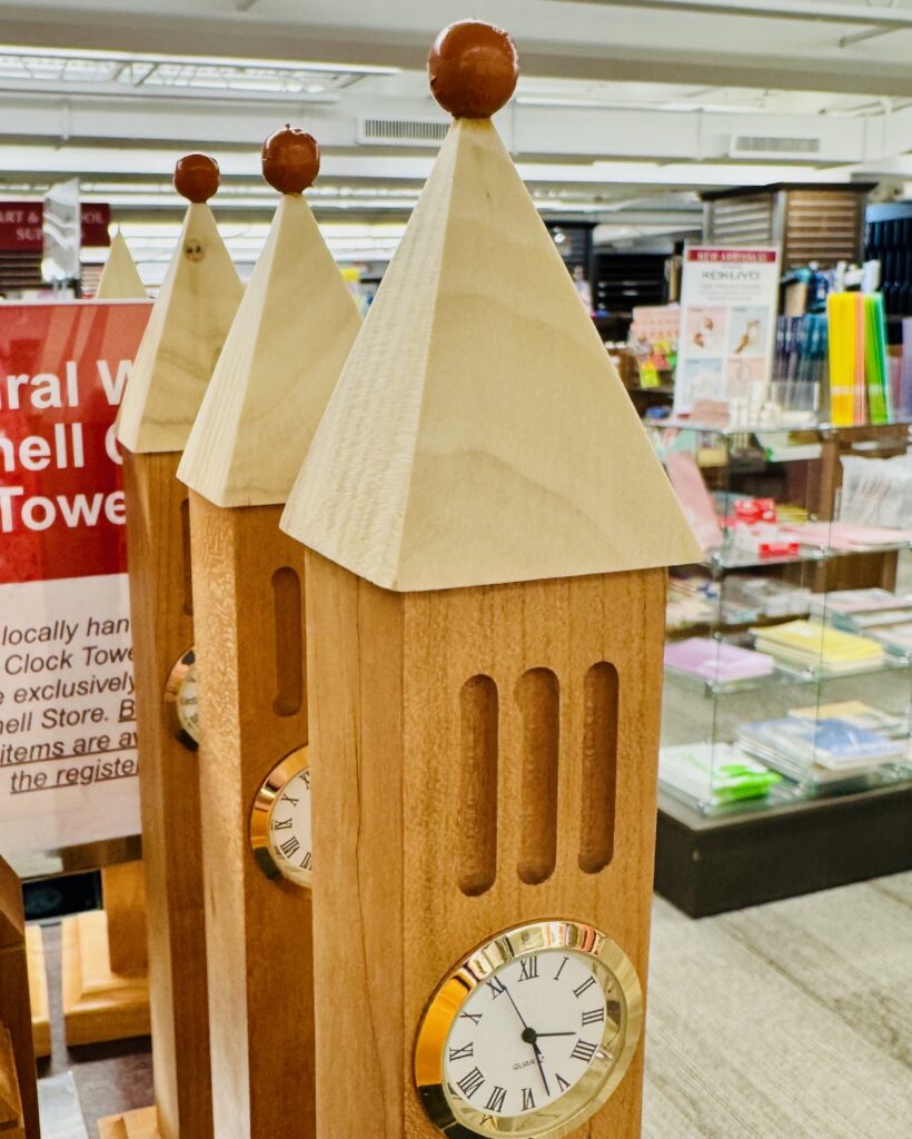 wooden clocks for sale in the Cornell Store shaped like the clock tower and with miniature wooden pumpkins atop them