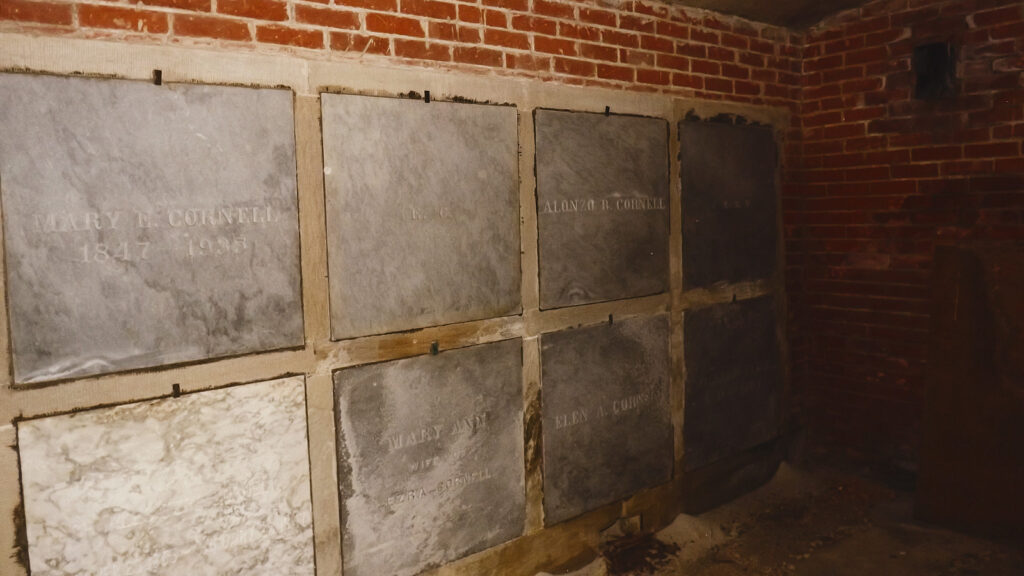 tablets marking the final resting places of more than a dozen Cornellians sit in the below-ground vault under the Sage Chapel memorial antechapel