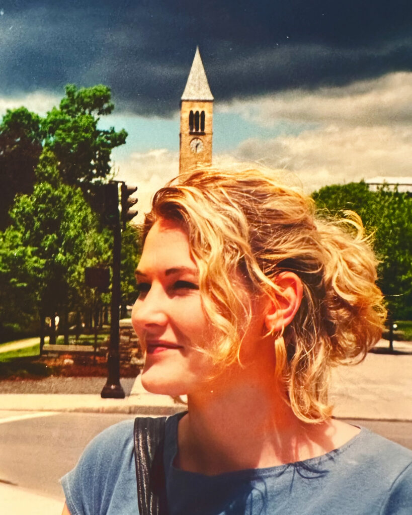 Wendy Stevens Larson ’00 on campus in 2000 with McGraw Tower in the background