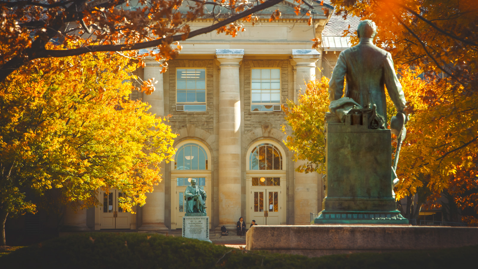 Goldwin Smith Hall and the statues of Ezra Cornell and A.D. White on the Arts Quad in fall
