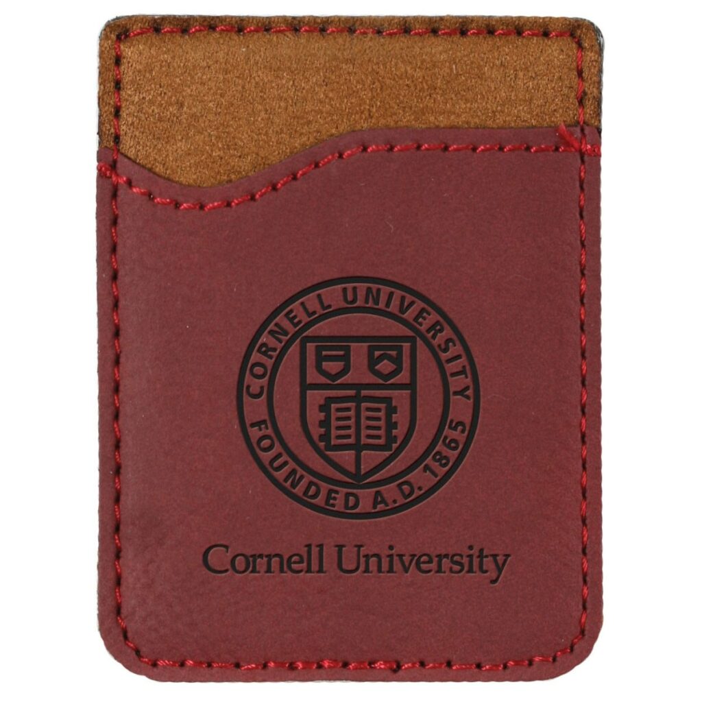 A leather card carrier that sticks to a phone with the Cornell seal on the front.