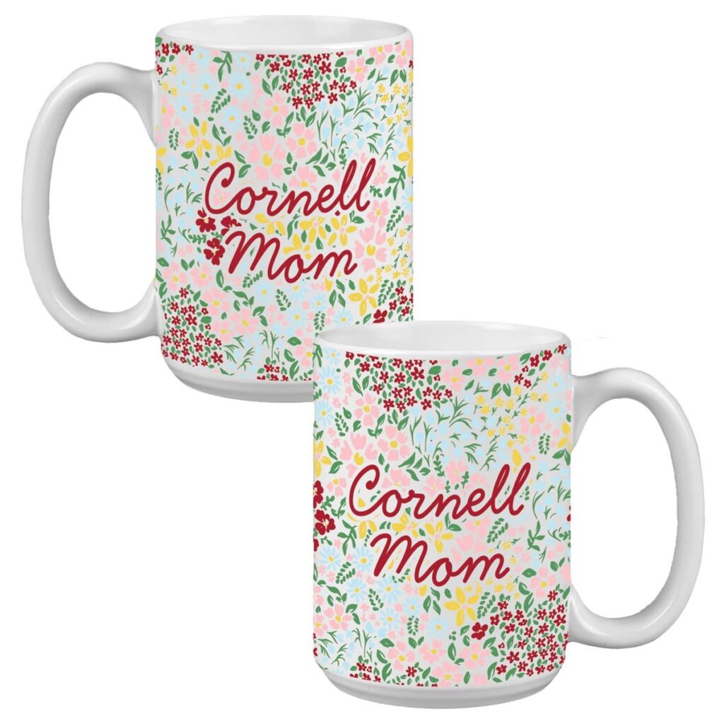 Two mugs with colorful flowers on them that say "Cornell Mom" in cursive on them.