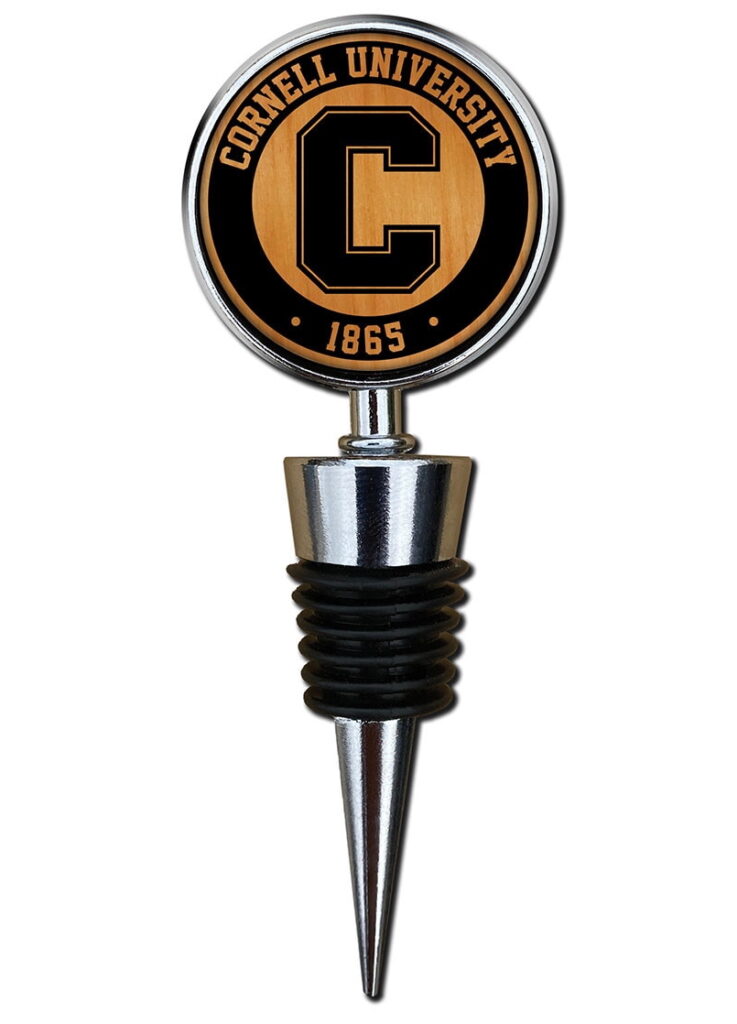 A wine stopper with a wooden Cornell logo on it.