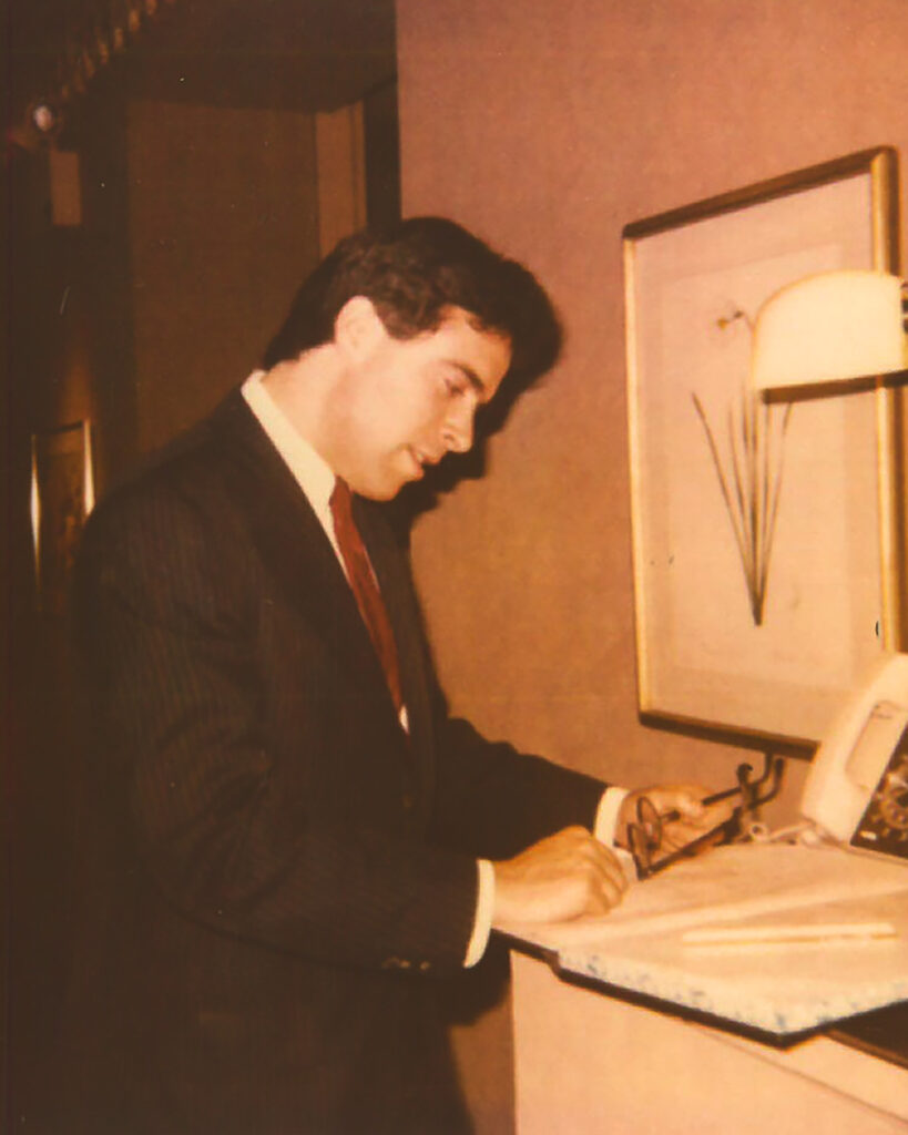 Drew Nieporent at the front desk of the restaurant 24 5th