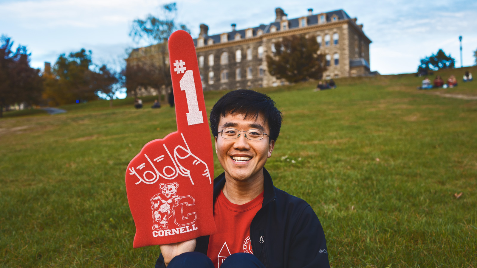 Tony Chen wearing a Cornell foam finger on Libe Slope
