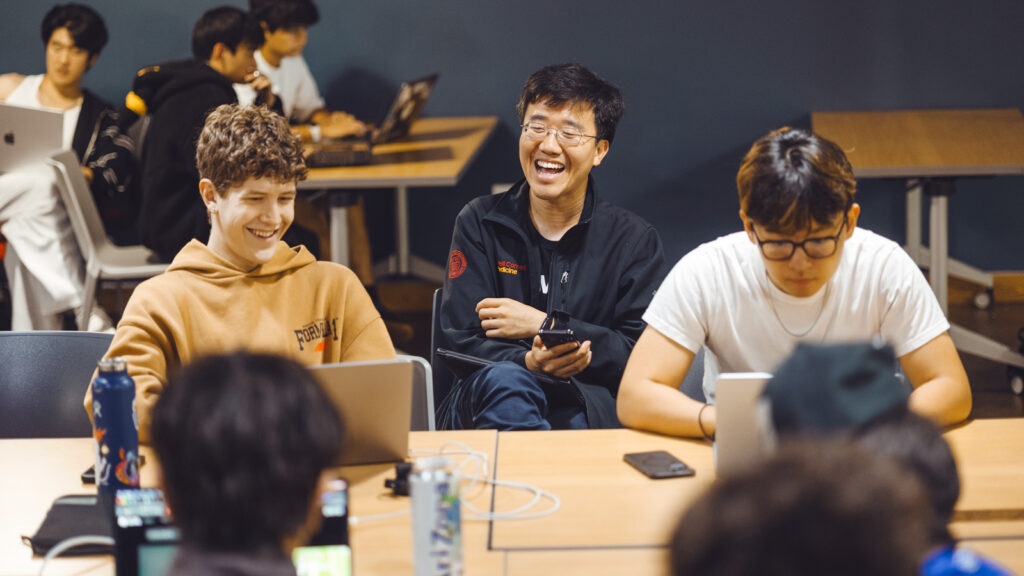 Tony Chen meets with Armada, a student group who builds side projects and businesses, in the eHub building in Collegetown.