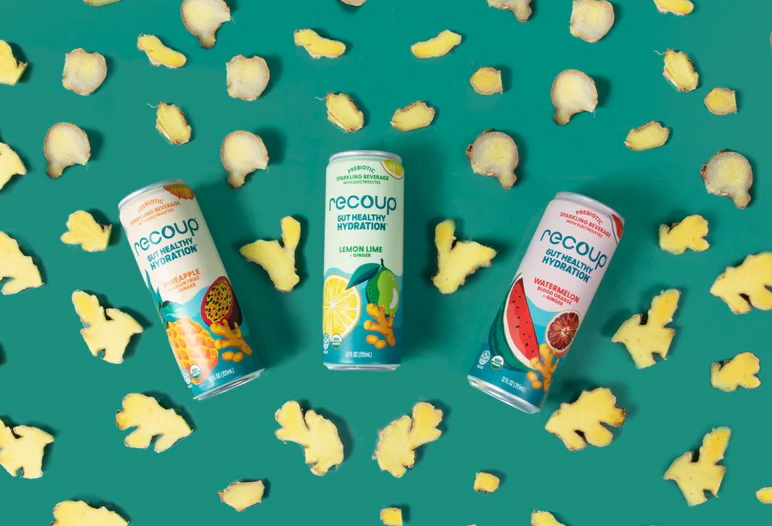 3 cans of Recoup beverages with fruit