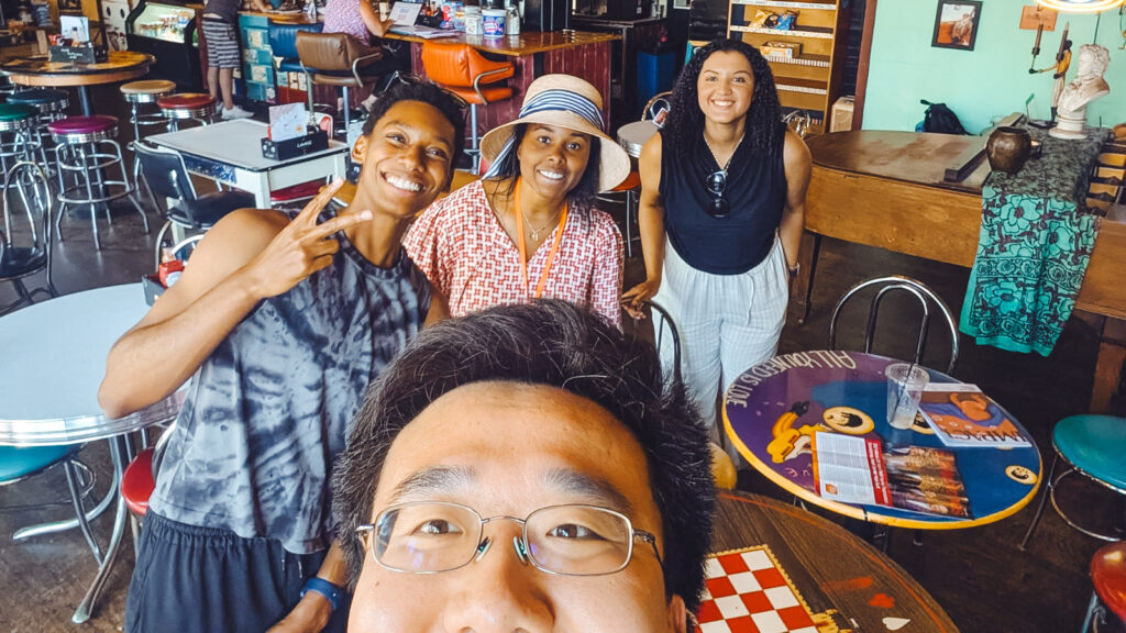 Tony Chen with three women in a restaurant