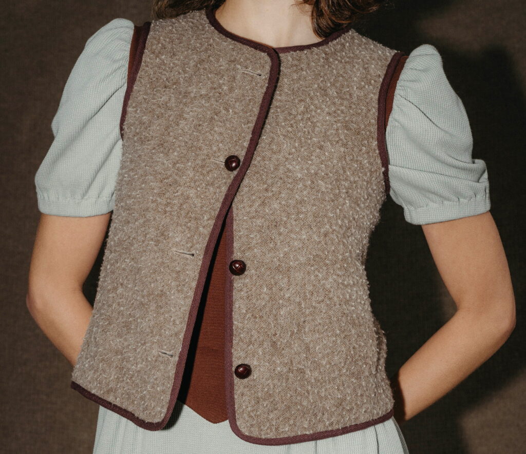 A beige tweed vest