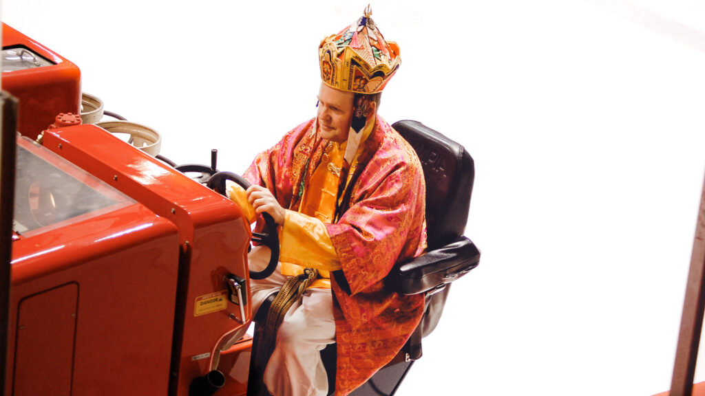 Dave Nulle driving an ice resurfacer at Lynah Rink, dressed as a sultan