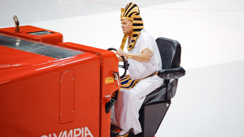 Dave Nulle driving an ice resurfacer at Lynah Rink, dressed as a pharaoh