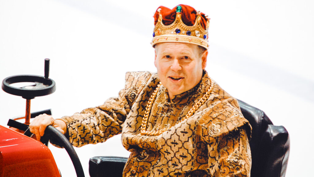 Dave Nulle driving an ice resurfacer at Lynah Rink, dressed as a prince