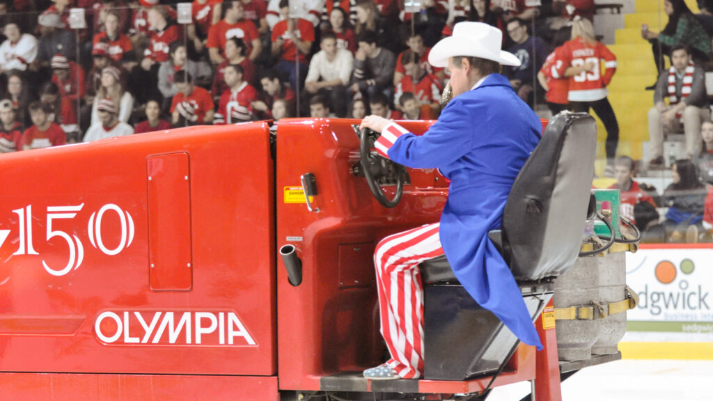 Dave Nulle driving an ice resurfacer at Lynah Rink, dressed as Uncle Sam