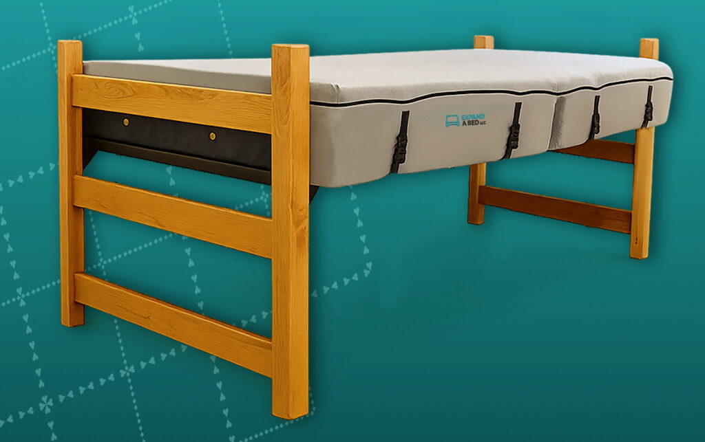 The Expand a Bed mattress extender on a bed