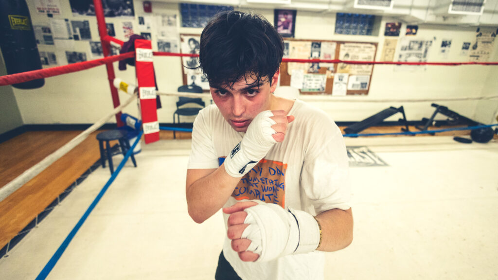 Will MacLeod with his hands up during sparing practice in the boxing ring at the Greater Ithaca Activities Center.