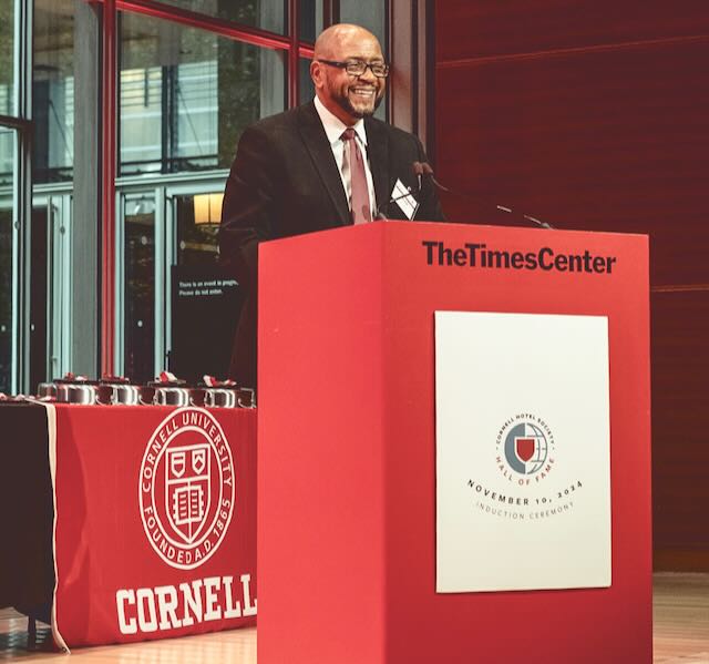 Calvin Stovall Jr. stands at a podium