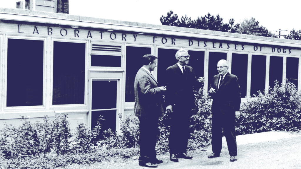Three men outside the Laboratory for Diseases of Dogs in 1951