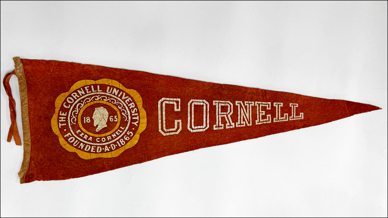 vintage red Cornell pennant on a white background