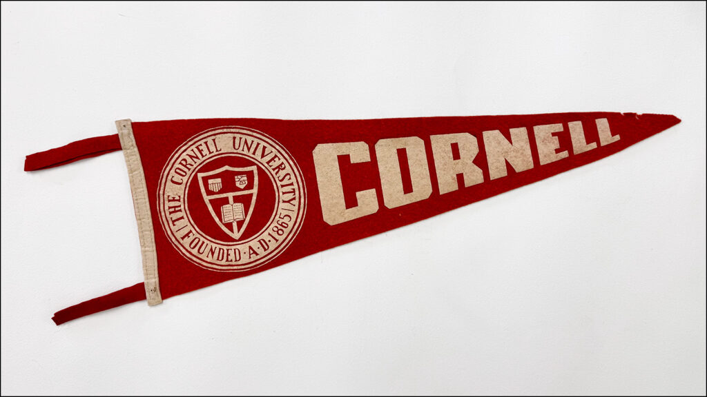 vintage red Cornell pennant on a white background