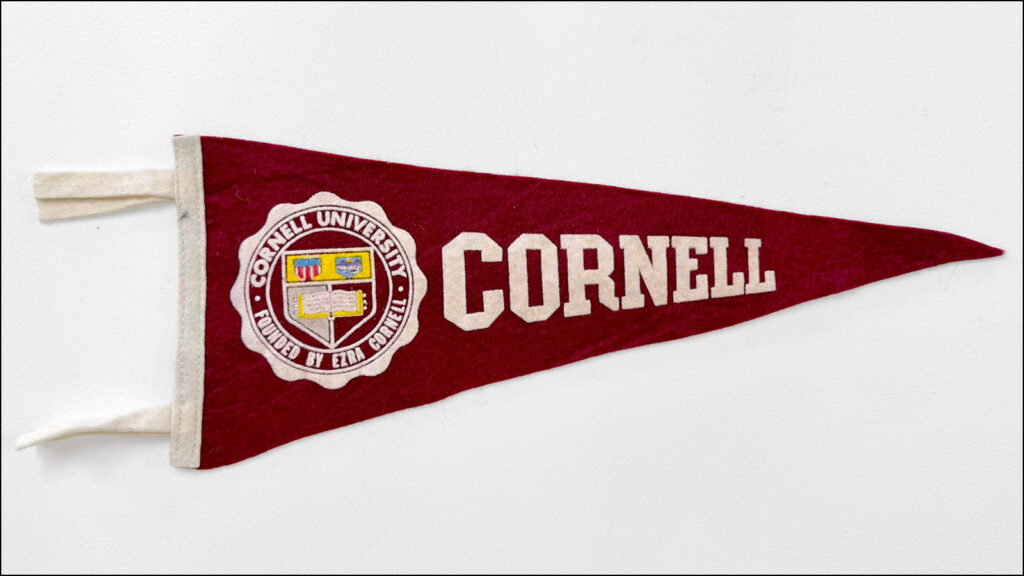 vintage red Cornell pennant on a white background