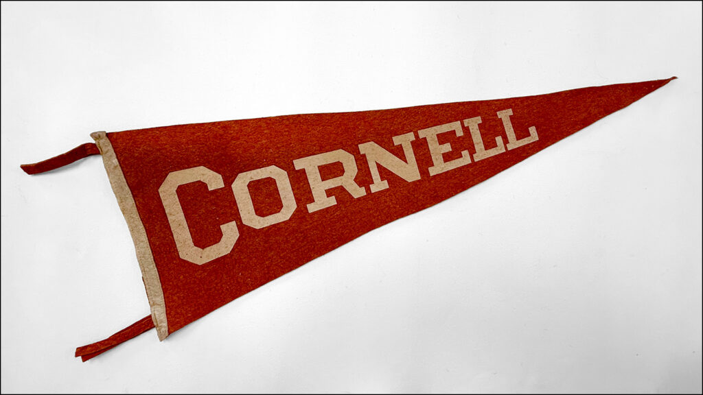 vintage red Cornell pennant on a white background