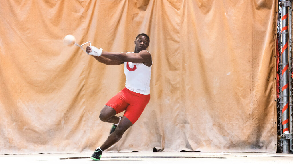 Stephen Mozia ’15 throws the shot put