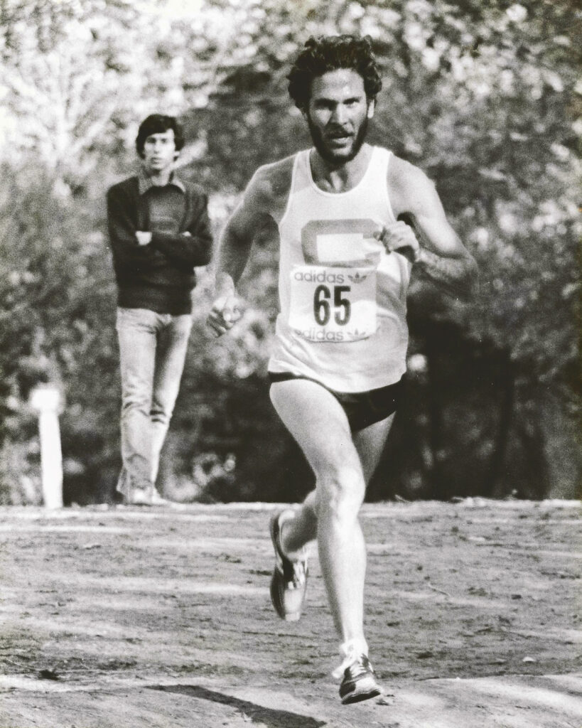 Pete Pfitzinger running cross country for the Big Red