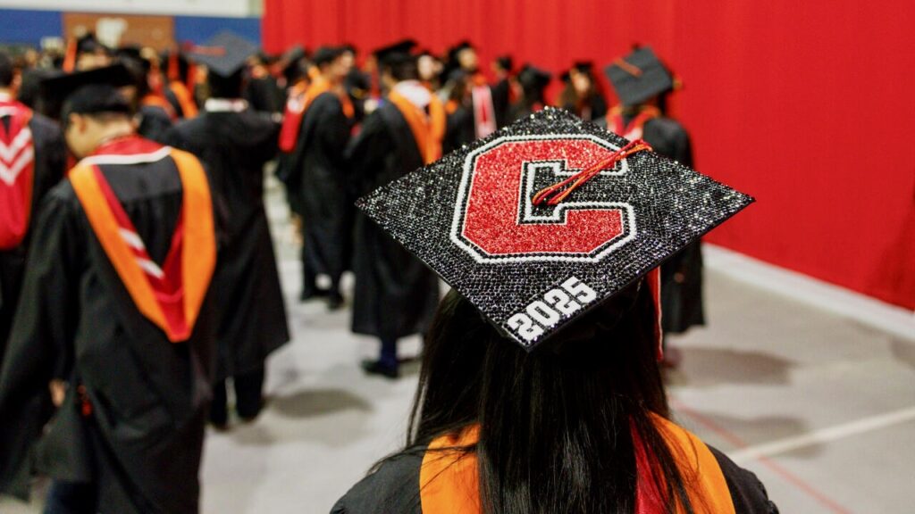 A decorated mortarboard, sporting a bedazzled "C" at the December 2025 recognition ceremony in Barton Hall