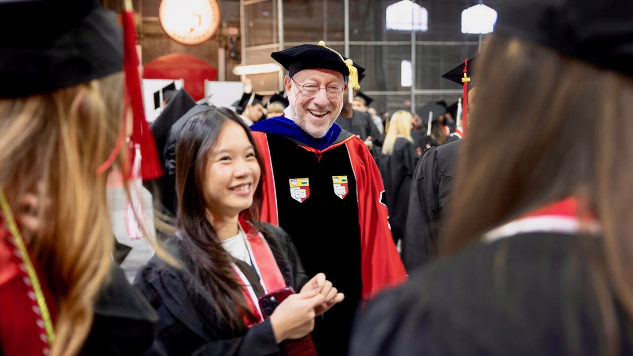 President Mike Kotlikoff mingles with graduating students at the December 2025 recognition ceremony in Barton Hall