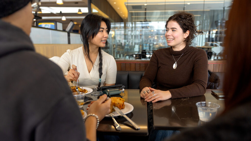 Students eat and talk to each other in Morrison Dining.