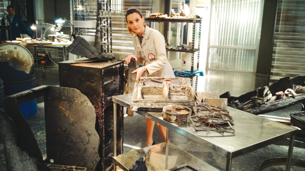 Carlo Callo on set in the lab while shooting for an episode of Bones.