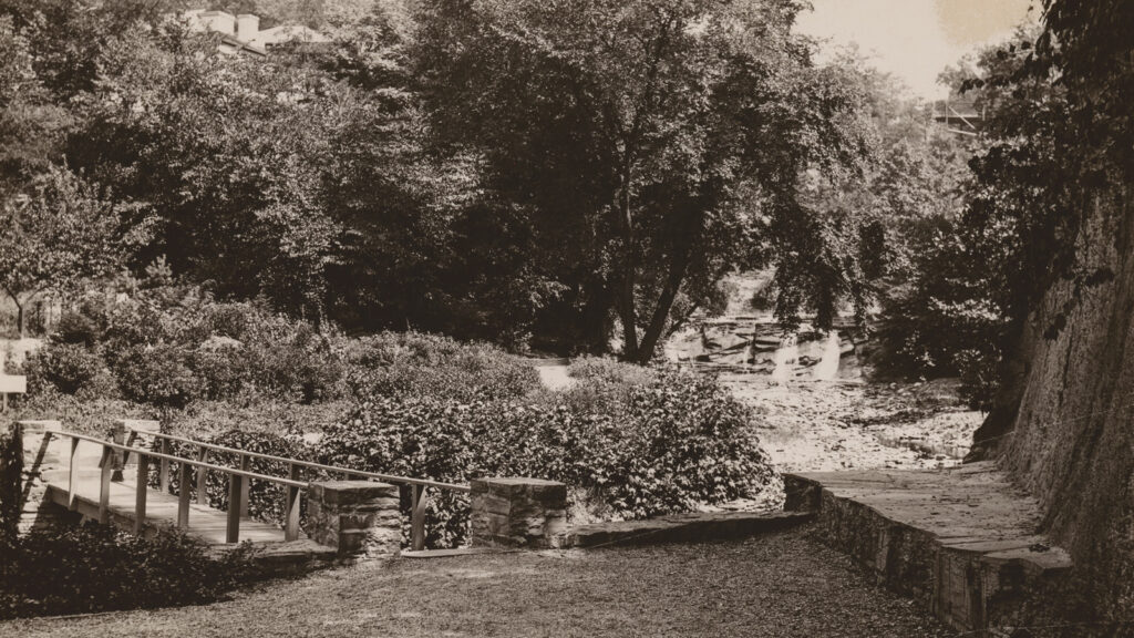 undated image of a footbridge over Cascadilla Gorge, one of the natural spaces that has been stewarded by the Cornell Botanic Gardens for decades