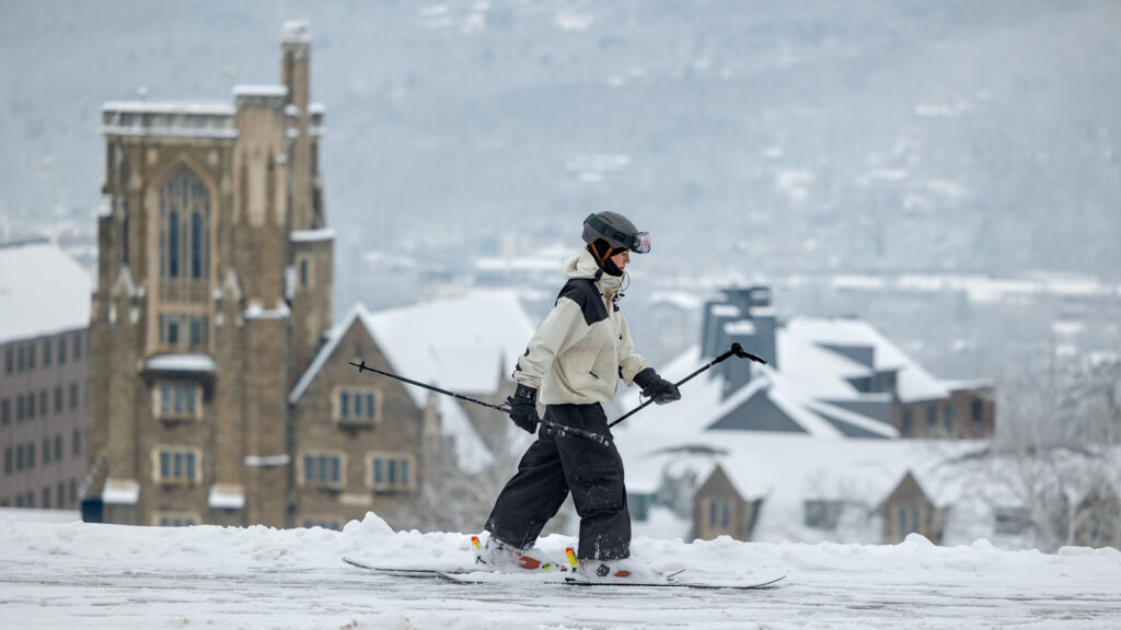A student skis at the top of Libe Slope