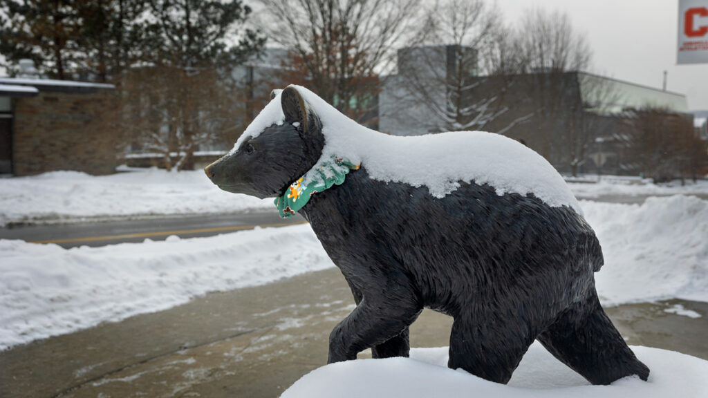 snow covers the Touchdown statue on campus
