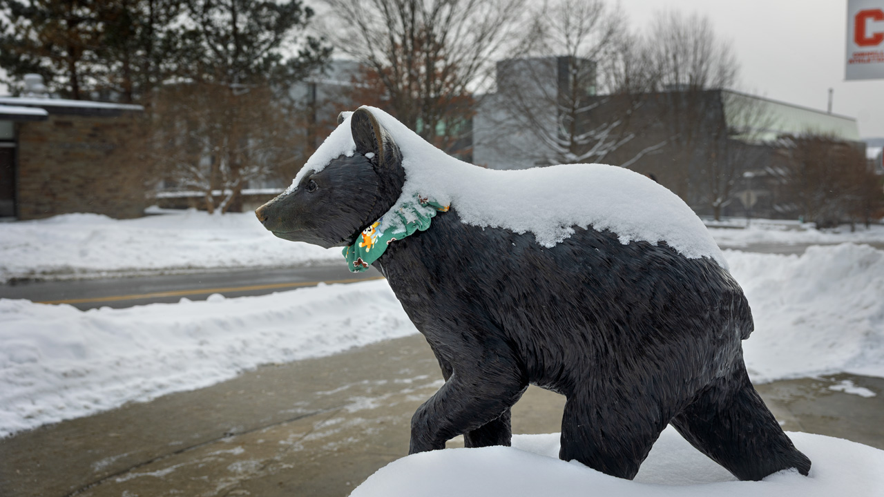 snow covers the Touchdown statue on campus