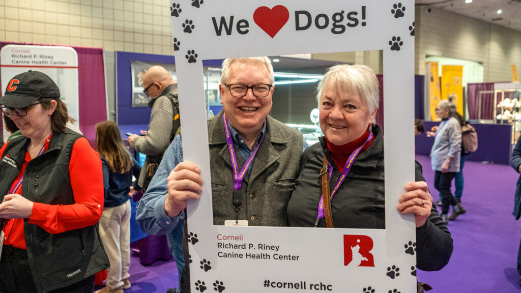 Two veterinarians pose in a photo cut-out for Cornell's Richard P. Riney Canine Heath Center at the 2026 Westminster Kennel Club Dog Show