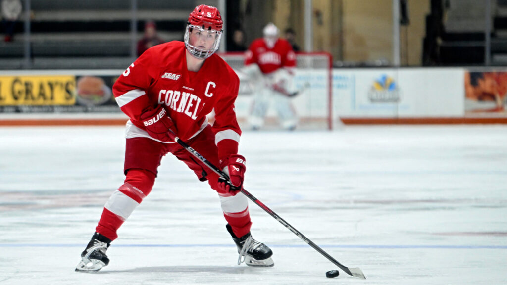 Rory Guilday playing hockey for Cornell