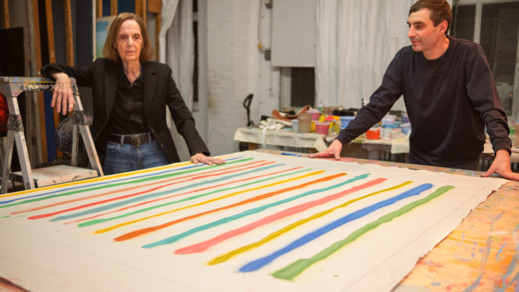 Pat Sutton Lipsky ’63 and her assistant evaluate a painting in progress in her Chelsea studio