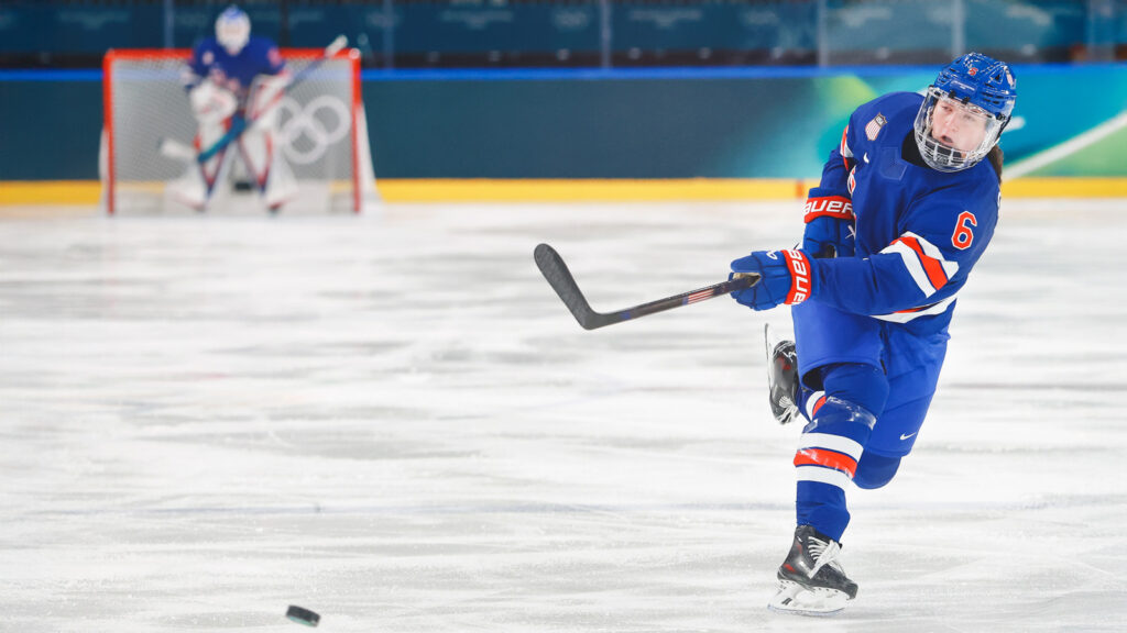 MILAN, ITALY - FEBRUARY 13: Rory Guilday #6 of Team United States takes a shot in the third period during the Women's Quarterfinals match between the United States and Italy on day seven of the Milano Cortina 2026 Winter Olympic games at Milano Rho Ice Hockey Arena on February 13, 2026 in Milan, Italy. (Photo by Elsa/Getty Images)