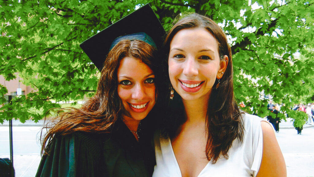 Heather and Jessica Margrill smile together at Heather's commencement.