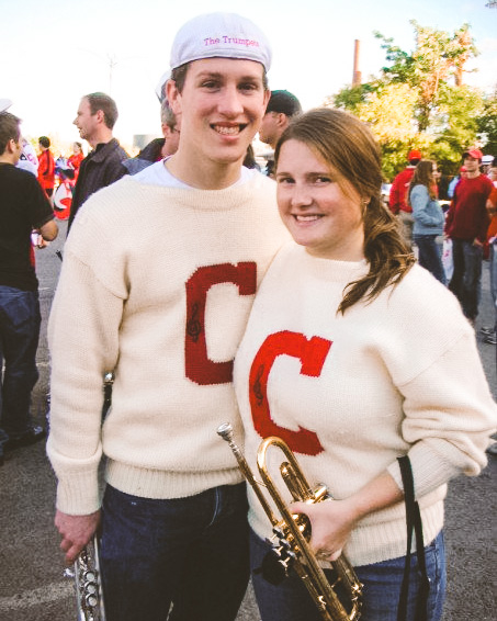 Nathaniel Olson ’05, MS ’08 & Brianna Bamford Olson ’07, MPA ’09 in Cornell sweaters holding instruments