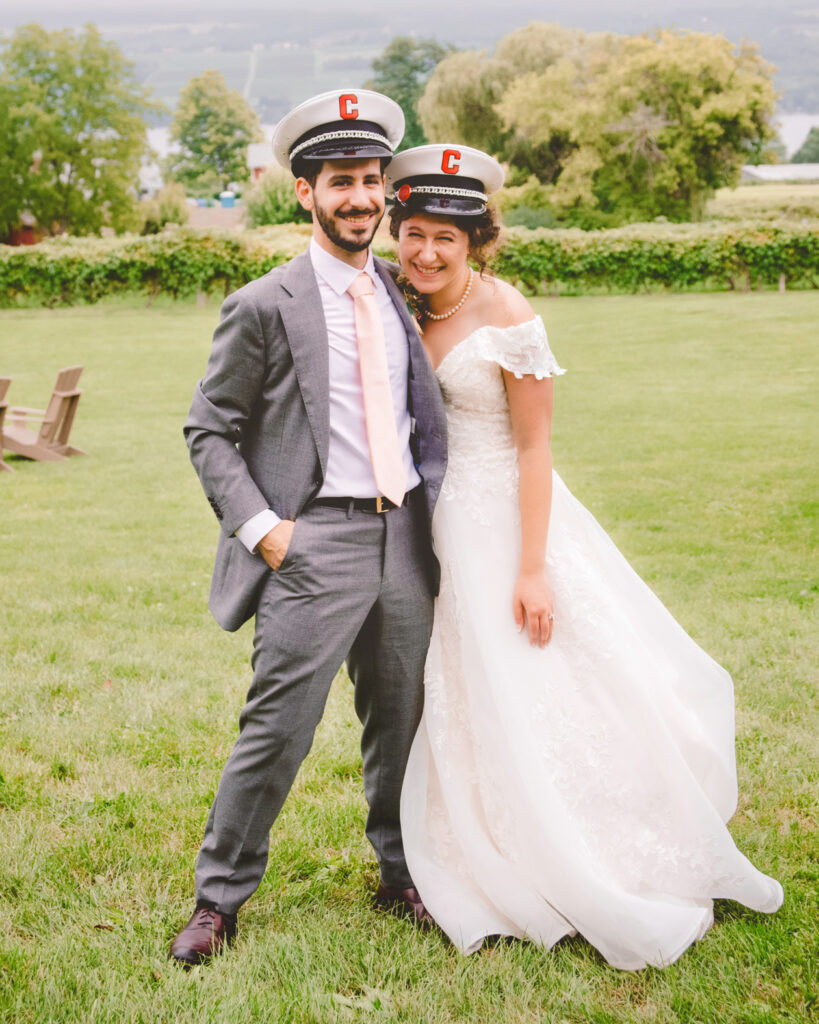 Emily Isenstein ’16 & Louis Widom ’16 wearing band hats in wedding attire