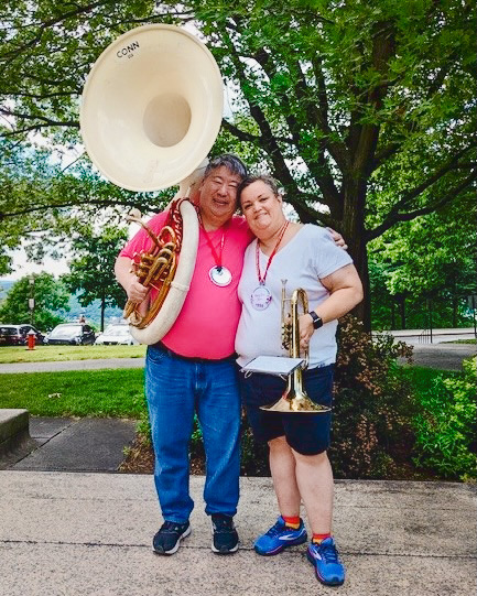 Joseph Youn ’91, MEng ’93 & Mary Sue Page Youn ’94 holding their instruments