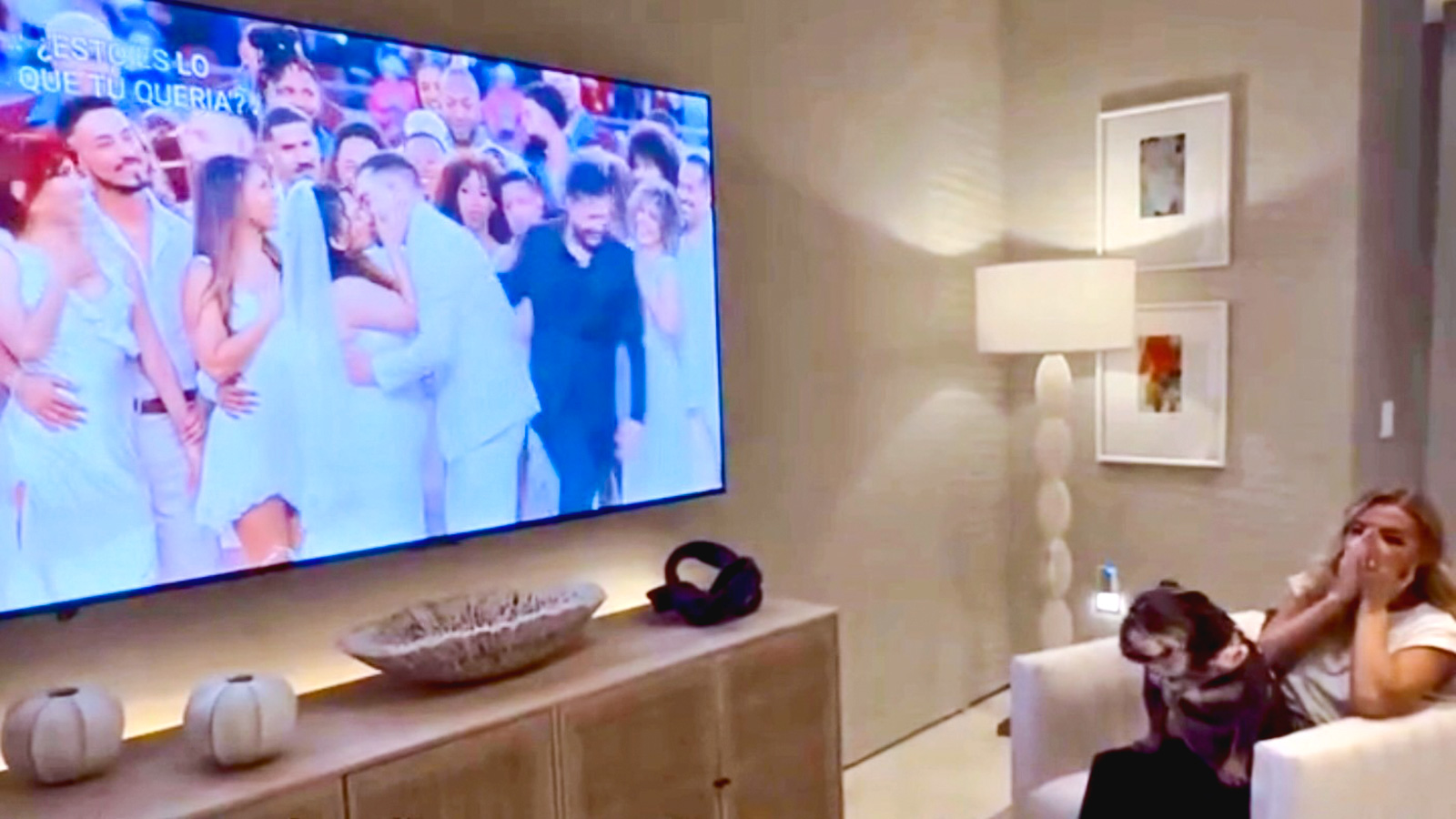 screenshot of a video from Hayley Paige's post of her reaction to her dress design being featured in the wedding scene during the halftime show at Super Bowl LX in 2026