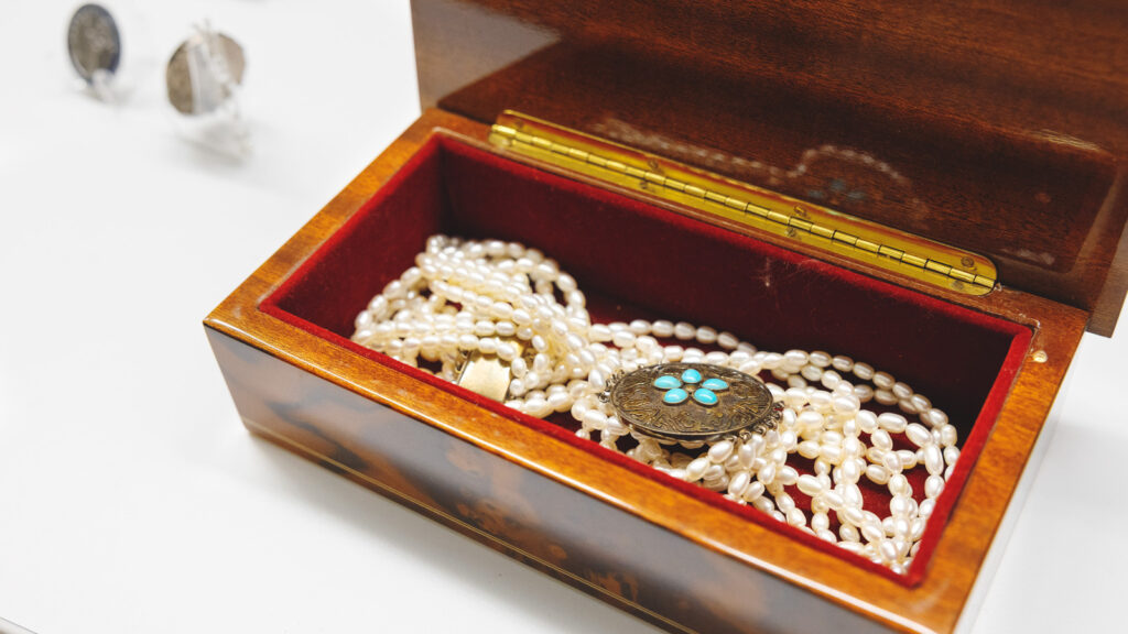 A pearl necklace in a wooden box