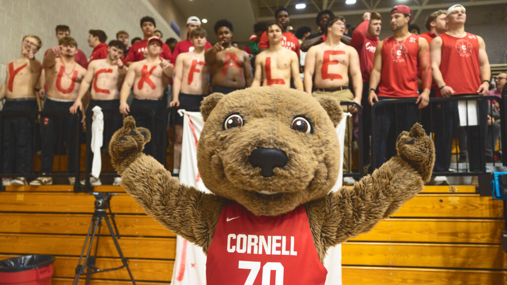 Touchdown in front of male fans wearing body paint that says YUCK FALE